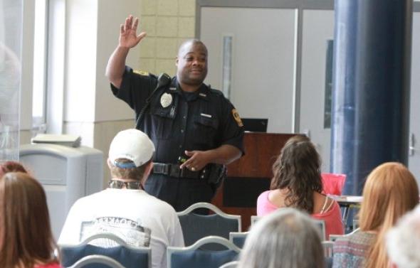A police officer answers questions during Welcome Week.